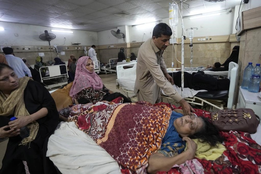 Patients of heatstroke receive treatment at a hospital in Karachi, Pakistan, Thursday, May 23, 2024. Doctors were treating hundreds of victims of heatstroke at various hospitals across Pakistan on Thursday after an intense spell of the heat wave began in the country, and the mercury rose to above normal due to climate change, officials said. (AP Photo/Fareed Khan)