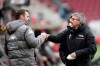 FILE - Then Mainz' head coach Bo Svensson, left, greets his Berlin colleague Urs Fischer prior the German Bundesliga soccer match between FSV Mainz 05 and Union Berlin in Mainz, Germany, Saturday, Feb. 6, 2021. Union announced Thursday that former Mainz coach Bo Svensson will take charge of the team. (Thomas Frey/dpa via AP, File)