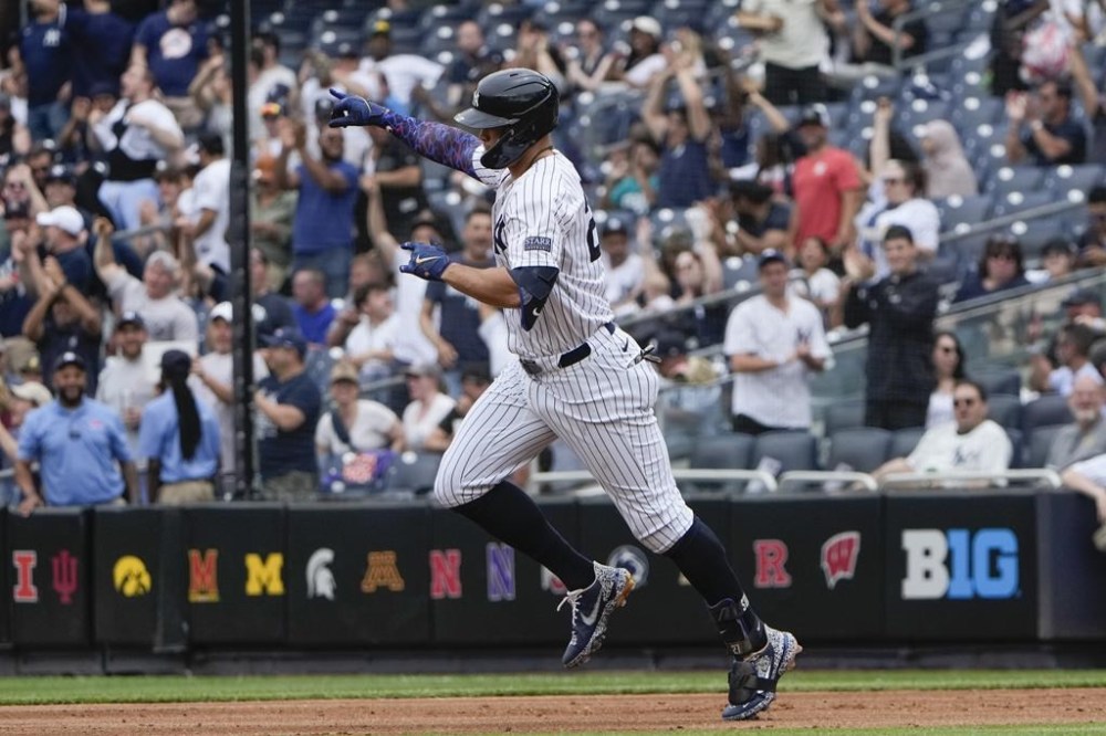 New York Yankees' Giancarlo Stanton reacts after hitting a solo home run during the second inning of the baseball game against the Seattle Mariners at Yankee Stadium Thursday, May 23, 2024, in New York. (AP Photo/Seth Wenig)
