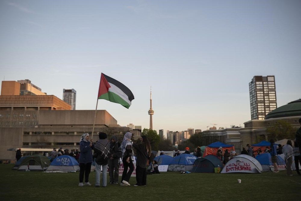 The University of Toronto, where students set up a pro-Palestinian encampment weeks ago, says it will not end any partnerships with Israeli universities as protesters have demanded. Protesters gather in an encampment set up on the University of Toronto campus in Toronto, Thursday, May 2, 2024. THE CANADIAN PRESS/Christopher Katsarov