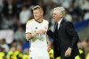 FILE - Real Madrid's head coach Carlo Ancelotti, right, and Real Madrid's Toni Kroos talk during the Spanish La Liga soccer match between Real Madrid and Deportivo Alaves at the Santiago Bernabeu stadium in Madrid, Spain, on May 14, 2024. Real Madrid said the 34-year-old German international “has decided to bring an end to his time as a professional footballer following Euro 2024.” (AP Photo/Jose Breton, File)