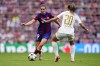 Barcelona's Mariona Caldentey, left, dribbles gthe ball in front of Lyon's Delphine Cascarino during the women's Champions League final soccer match between FC Barcelona and Olympique Lyonnais at the San Mames stadium in Bilbao, Spain, Saturday, May 25, 2024. (AP Photo/Jose Breton)