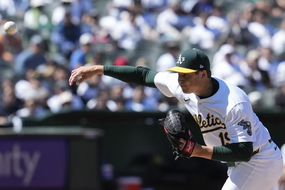 Oakland Athletics pitcher Mason Miller throws to a Houston Astros batter during the ninth inning of a baseball game Saturday, May 25, 2024, in Oakland, Calif. (AP Photo/Godofredo A. Vásquez)