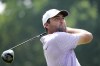 Scottie Scheffler hits a tee shot on the 18th hole during the third round of the Charles Schwab Challenge golf tournament at Colonial Country Club in Fort Worth, Texas, Saturday, May 25, 2024. (AP Photo/LM Otero)