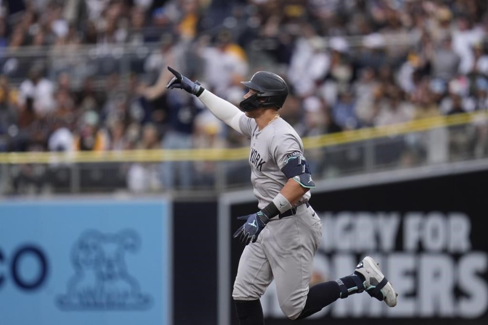 New York Yankees' Aaron Judge celebrates after hitting a two-run home run during the first inning of a baseball game against the San Diego Padres, Saturday, May 25, 2024, in San Diego. (AP Photo/Gregory Bull)