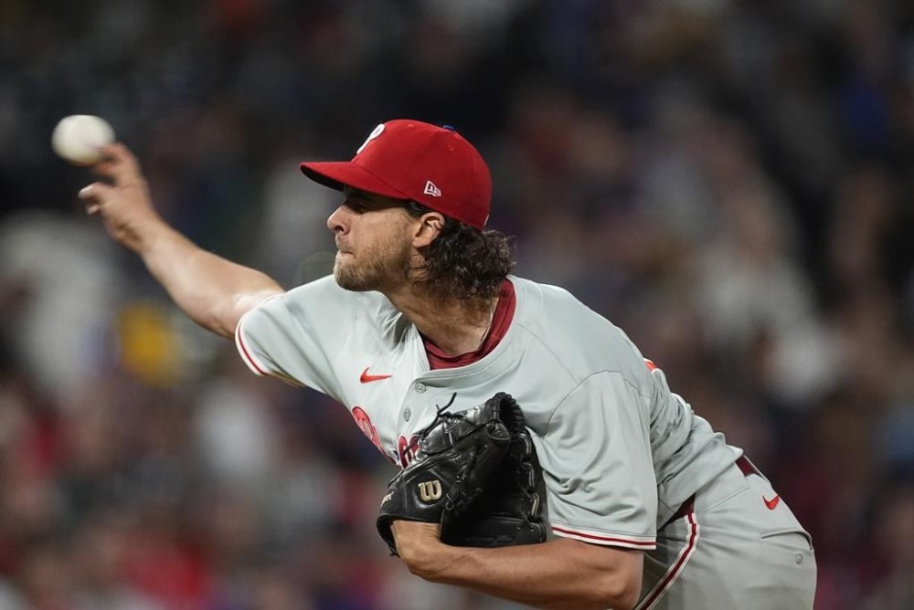 Philadelphia Phillies starting pitcher Aaron Nola works against the Colorado Rockies in the third inning of a baseball game Saturday, May 25, 2024, in Denver. (AP Photo/David Zalubowski)