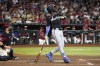 Miami Marlins' Chisholm Jr. watches his RBI double against the Arizona Diamondbacks during the sixth inning of a baseball game Saturday, May 25, 2024, in Phoenix. (AP Photo/Rick Scuteri)