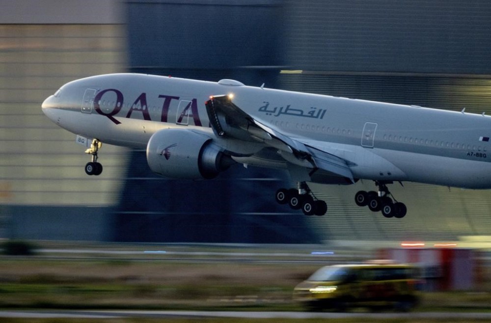 FILE - A Qatar airways plane lands at the airport in Frankfurt, Germany, as the sun rises on Sept. 25, 2023. Twelve people were injured when a Qatar Airways plane flying from Doha to Dublin on Sunday May 26, 2024 hit turbulence, airport authorities said. (AP Photo/Michael Probst, File)