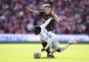 Leeds United's Wilfried Gnonto, right, and Southampton's Flynn Downes battle for the ball during the Championship play-off final between Leeds United and Southampton at Wembley Stadium, London, Sunday May 26, 2024. (John Walton/PA via AP)