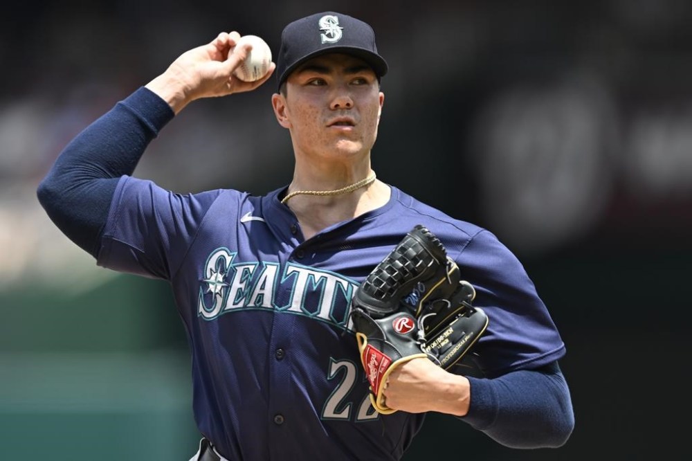Seattle Mariners starting pitcher Bryan Woo throws during the first inning of a baseball game against the Washington Nationals, Sunday, May 26, 2024, in Washington. (AP Photo/John McDonnell)