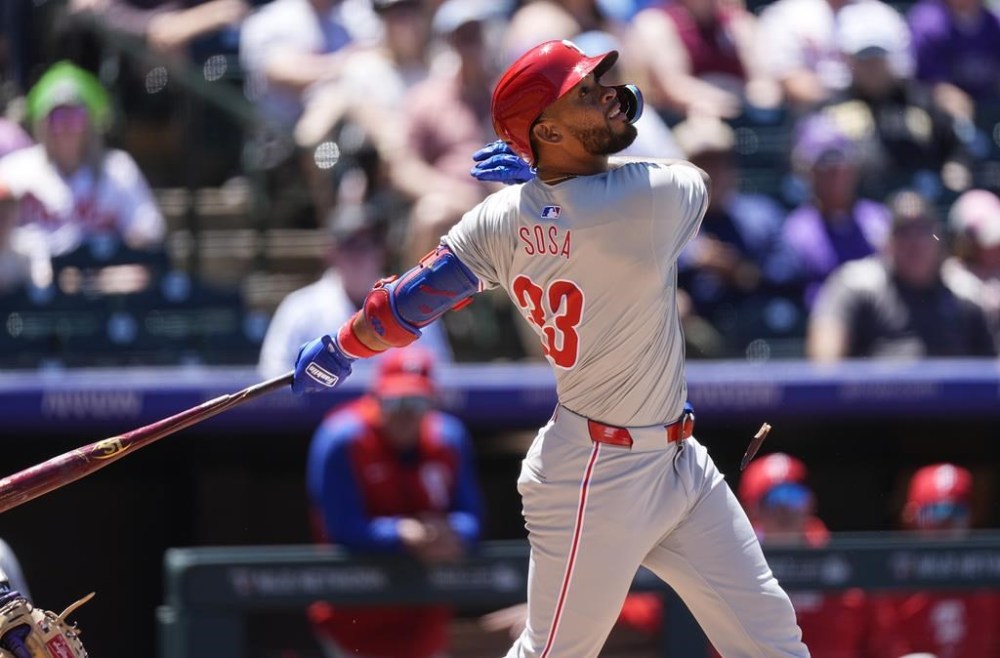 Philadelphia Phillies' Edmundo Sosa pops out against Colorado Rockies starting pitcher Cal Quantrill in the third inning of a baseball game, Sunday, May 26, 2024, in Denver. (AP Photo/David Zalubowski)