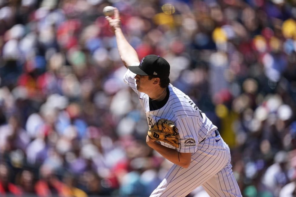 Colorado Rockies starting pitcher Cal Quantrill works against the Philadelphia Phillies in the third inning of a baseball game, Sunday, May 26, 2024, in Denver. (AP Photo/David Zalubowski)