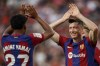 Barcelona's Robert Lewandowski celebrates after scoring his side's first goal during a Spanish La Liga soccer match between Sevilla and FC Barcelona at the Ramon Sanchez Pizjuan stadium in Seville, Spain, Sunday, May 26, 2024. (AP Photo/Fermin Rodriguez)