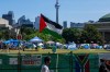A Palestinian flag flies over the pro-Palestinian encampment set up at the University of Toronto campus in Toronto on Sunday, May 26, 2024. Pro-Palestinian protesters who have been camped out at the University of Toronto for weeks say they have no plans to honour the terms of a trespass notice issued by the school and clear the demonstration site by 8 a.m. THE CANADIAN PRESS/Frank Gunn