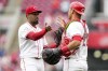 Cincinnati Reds' Alexis Díaz, left, celebrates with teammate Luke Maile after the Reds defeated the Los Angeles Dodgers in a baseball game Sunday, May 26, 2024, in Cincinnati. (AP Photo/Jeff Dean)