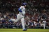 Chicago Cubs' Ian Happ rounds the bases after hitting a two-run home run during the seventh inning of a baseball game against the St. Louis Cardinals Sunday, May 26, 2024, in St. Louis. (AP Photo/Jeff Roberson)