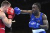 Canada's Keven Beausejour, right, is shown in action during the men's light heavyweight quarterfinal boxing bout against Scotland's Sean Lazzerini at the Commonwealth Games in Birmingham, England, Wednesday, Aug. 3, 2022. Beausejour lost 3-2 to Japan's Go Wakaya in round-of-16 action in the men's 80-kilogram class in an Olympic qualifying tournament on Monday. THE CANADIAN PRESS/AP/Rui Vieira
