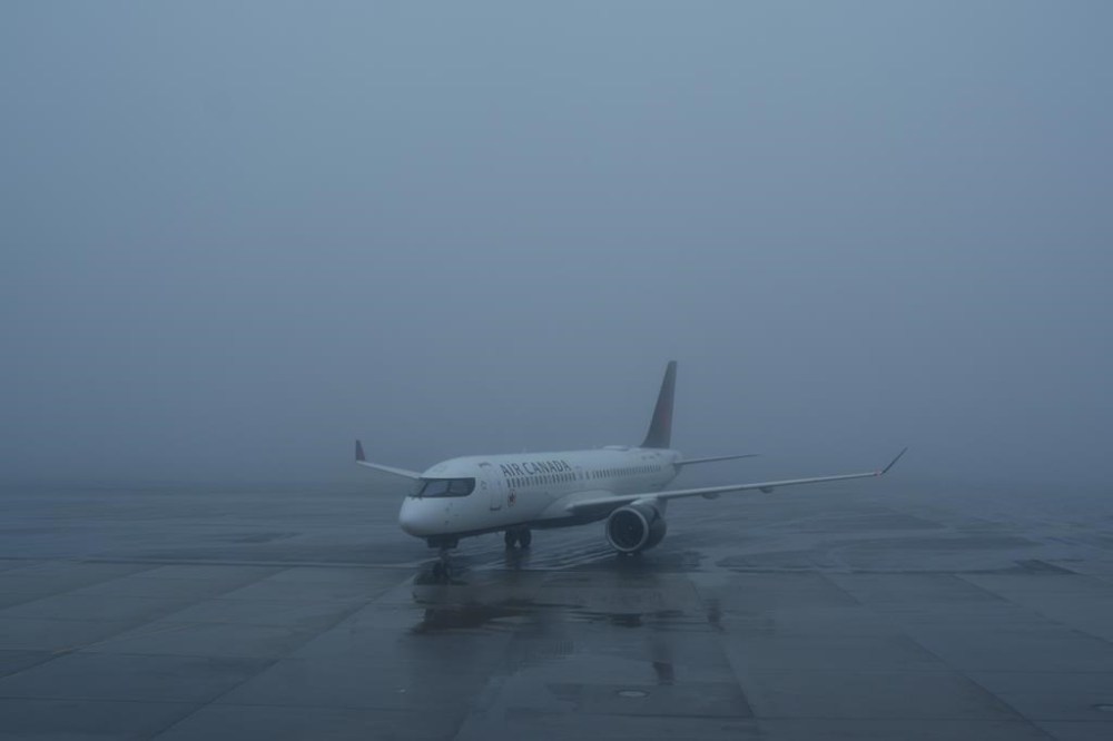 The Competition Bureau says market concentration, prices and a rising tally of customer complaints are fuelling its study into Canada's airline industry. An Air Canada plane taxis towards the gate in poor weather conditions at Halifax Airport, on Wednesday, March 27, 2024. THE CANADIAN PRESS/Chris Young