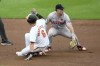 Baltimore Orioles' Ryan Mountcastle (6) slides into second base with a double during the fourth inning of a baseball game against Boston Red Sox shortstop Romy Gonzalez, right, Monday, May 27, 2024, in Baltimore. (AP Photo/Nick Wass)