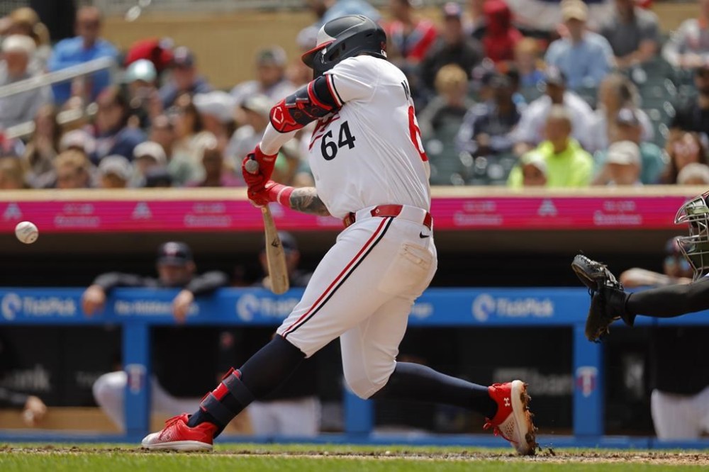 Minnesota Twins' Jose Miranda hits a two-run home run against the Kansas City Royals in the third inning of a baseball game Monday, May 27, 2024, in Minneapolis. (AP Photo/Bruce Kluckhohn)
