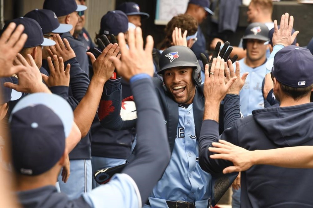 Toronto Blue Jays' George Springer celebrates in the dugout after hitting a two-run home run against the Chicago White Sox during the second inning of a baseball game, Monday, May 27, 2024, in Chicago. (AP Photo/Matt Marton)