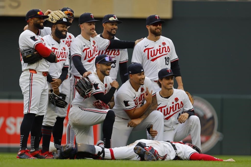 The Minnesota Twins pose for a photo to celebrate after their win over the Kansas City Royals in a baseball game Monday, May 27, 2024, in Minneapolis. (AP Photo/Bruce Kluckhohn)
