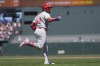 Philadelphia Phillies' Kyle Schwarber gestures to teammates after hitting a two-run home run against the San Francisco Giants during the third inning of a baseball game in San Francisco, Monday, May 27, 2024. (AP Photo/Jeff Chiu)
