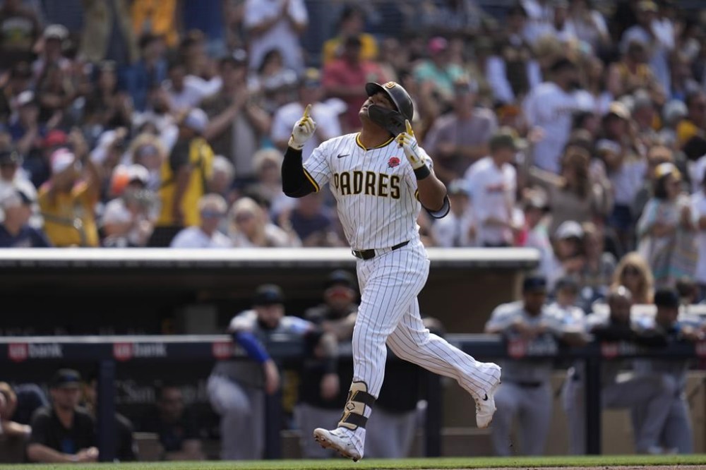 San Diego Padres' Donovan Solano celebrates after hitting a home run during the second inning of a baseball game against the Miami Marlins Monday, May 27, 2024, in San Diego. (AP Photo/Gregory Bull)