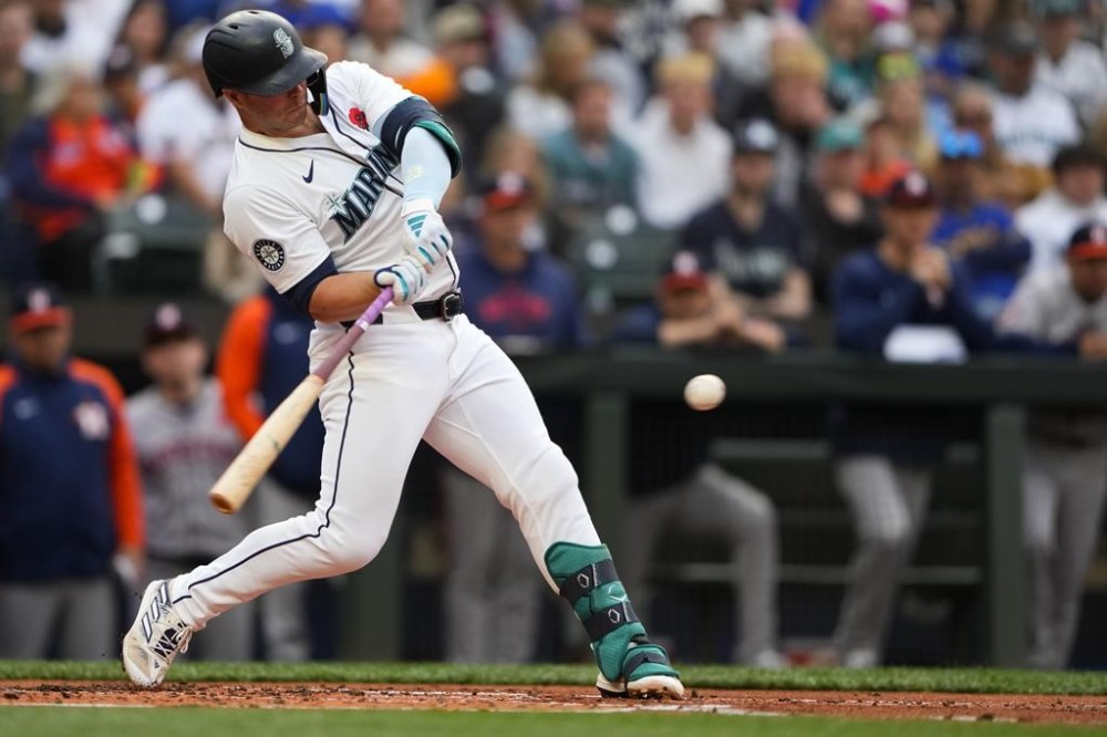 Seattle Mariners' Ty France hits an RBI single to score Julio Rodríguez against the Houston Astros during the first inning of a baseball game Monday, May 27, 2024, in Seattle. (AP Photo/Lindsey Wasson)