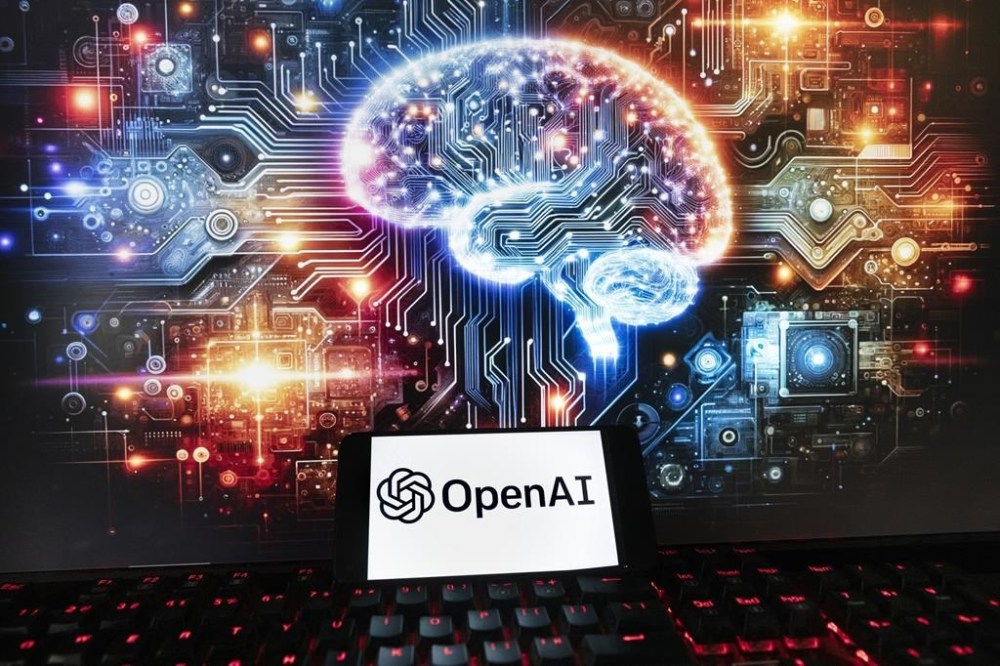 FILE - The OpenAI logo is seen displayed on a cell phone with an image on a computer monitor generated by ChatGPT's Dall-E text-to-image model, Friday, Dec. 8, 2023, in Boston. OpenAI says it's setting up a new safety and security committee and has begun training a new artificial intelligence model to supplant the GPT-4 system that underpins its ChatGPT chatbot. The San Francisco startup said in a blog post Tuesday May 28, 2024 that the committee will advise the full board on “critical safety and security decisions