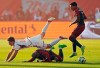 FC Cincinnati's Bret Halsey (15) falls over Toronto FC's Deybi Flores (20) as Jahkeele Marshall-Rutty (7) looks on during MLS soccer action in Toronto on Saturday, May 25, 2024. Toronto FC looks to tighten up its defence as it heads south for games Wednesday against the Philadelphia Union and Saturday against D.C. United. THE CANADIAN PRESS/Frank Gunn