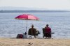 People take to the waters and shores of the Ottawa River in the Ottawa suburb of Constance Bay on Tuesday, July 6, 2023. The Weather Network is predicting more sunshine and warmer temperatures for the summer. THE CANADIAN PRESS/Sean Kilpatrick