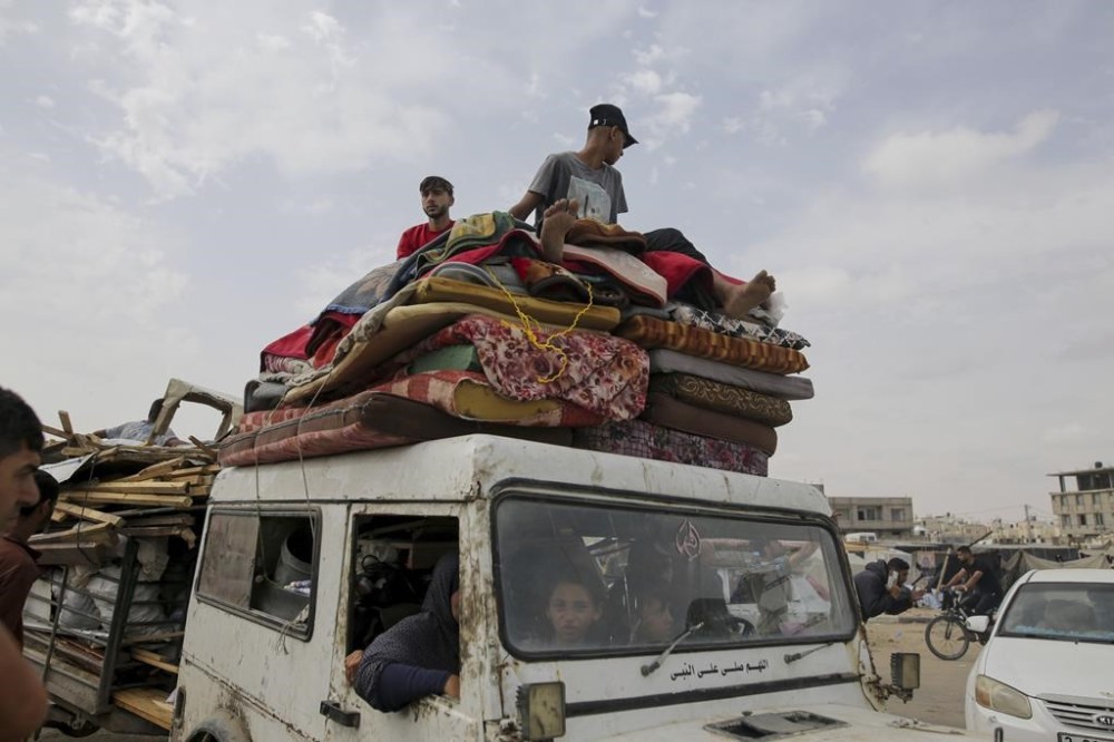 Palestinians fleeing from the southern Gaza city of Rafah during an Israeli ground and air offensive in the city on Tuesday, May 28, 2024. (AP Photo/Jehad Alshrafi)