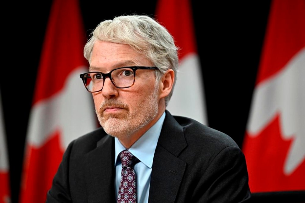 Privacy Commissioner of Canada Philippe Dufresne takes part in a news conference in Ottawa, on Thursday, Feb. 29, 2024. Dufresne and a government official are warning legislators to dramatically narrow the scope of a Senate bill proposing to block minors from accessing