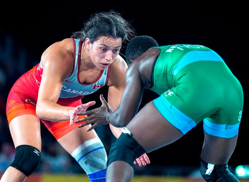 Canada's Justina di Stasio , left, fights Hannah Amuchechi Rueben from Nigeria in women's 76 kg freestyle wrestling competition at the Commonwealth Games in Coventry, England on Saturday, Aug. 6, 2022. World champion Di Stasio and veteran Amar Dhesi will lead Canada's wrestling team into the Olympic Games in Paris. THE CANADIAN PRESS/Andrew Vaughan