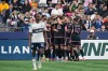 Inter Miami's Leonardo Campana (8) celebrates with his teammates after scoring as Vancouver Whitecaps' Ali Ahmed, front left, looks on during the second half of an MLS soccer match, in Vancouver, on Saturday, May 25, 2024. THE CANADIAN PRESS/Darryl Dyck