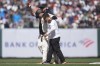 San Francisco Giants' LaMonte Wade Jr., middle, walks off the field with manager Bob Melvin, back, and a trainer after being injured on his double against the Philadelphia Phillies during the fifth inning of a baseball game in San Francisco, Monday, May 27, 2024. (AP Photo/Jeff Chiu)