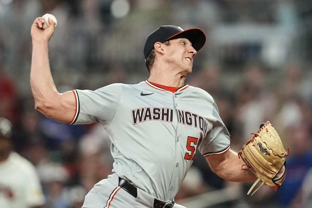 Washington Nationals pitcher Jacob Barnes (59) delivers in the seventh inning of a baseball game against the Atlanta Braves, Tuesday, May 28, 2024, in Atlanta. (AP Photo/Mike Stewart)