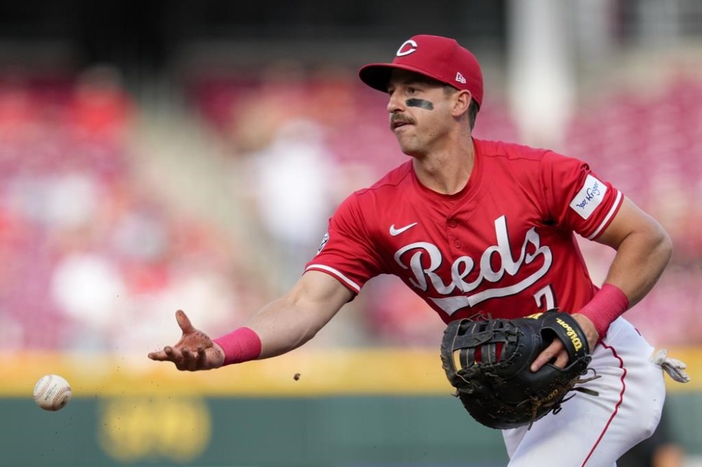 Cincinnati Reds first baseman Spencer Steer throws out St. Louis Cardinals' Lars Nootbaar at first base during the first inning of a baseball game Tuesday, May 28, 2024, in Cincinnati. (AP Photo/Jeff Dean)