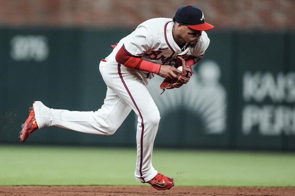 Atlanta Braves shortstop Orlando Arcia (11) catches the ball off ghe bat of Washington Nationals' CJ Abrams (5) in the eighth inning of a baseball game, Tuesday, May 28, 2024, in Atlanta. (AP Photo/Mike Stewart)