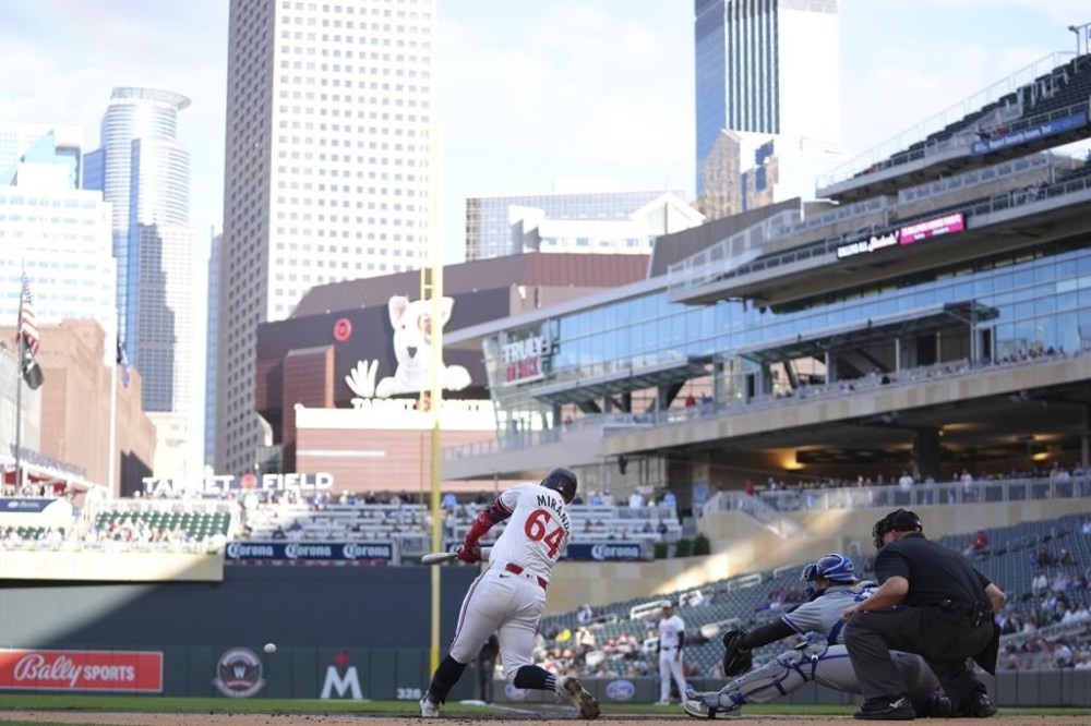 Minnesota Twins' Jose Miranda (64) hits a two-run single during the first inning of a baseball game against the Kansas City Royals, Tuesday, May 28, 2024, in Minneapolis. (AP Photo/Abbie Parr)