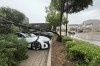 A split tree lays on a vehicle outside an Equinox gym Tuesday, May 28, 2024, in Dallas. (Leah Waters/The Dallas Morning News via AP)