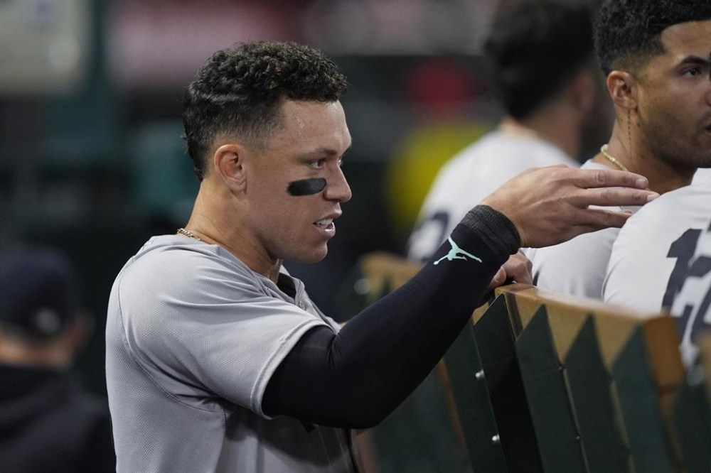 New York Yankees center fielder Aaron Judge gestures in the dugout during the seventh inning of the team's baseball game against the Los Angeles Angels, Tuesday, May 28, 2024, in Anaheim, Calif. (AP Photo/Ryan Sun)