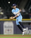 Toronto Blue Jays shortstop Bo Bichette throws out Chicago White Sox's Andrew Benintendi at first to end the eighth inning of a baseball game Tuesday, May 28, 2024, in Chicago. (AP Photo/Charles Rex Arbogast)