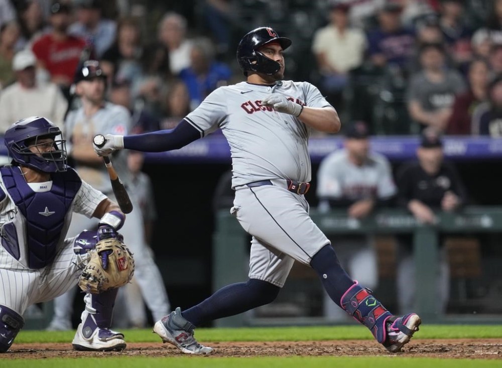 Cleveland Guardians' Josh Naylor watches the flight of a three run home ball hit against the Colorado Rockies during the eighth inning of a baseball game Tuesday, May 28, 2024, in Denver. (AP Photo/Jack Dempsey)