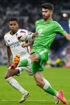 Real Madrid's Rodrygo, left, fights for the ball with Betis' Ricardo Visus during a Spanish La Liga soccer match between Real Madrid and Betis at the Santiago Bernabeu stadium in Madrid, Spain, Saturday, May 25, 2024. (AP Photo/Manu Fernandez)