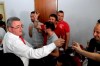 FILE - Albanian Football Federation President Armand Duka celebrates with journalists and other officials after being awarded victory over Serbia in the Euro qualifier by the top sports court, Tirana, Friday, July 10, 2015. A tournament co-hosting bid by Albania and Serbia is an unlikely project in European soccer and politics. The Balkan neighbors’ soccer federations have surprisingly teamed up to persuade UEFA to award them the men’s Under-21 European Championship. (AP Photo/Hektor Pustina, File)