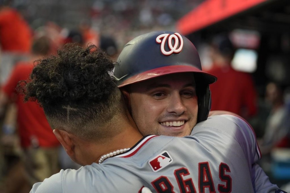 Washington Nationals' Lane Thomas (28) celebrates in the dugout after hitting a three-run home run in the fifth inning of a baseball game against theAtlanta Braves, Wednesday, May 29, 2024, in Atlanta. (AP Photo/Brynn Anderson)