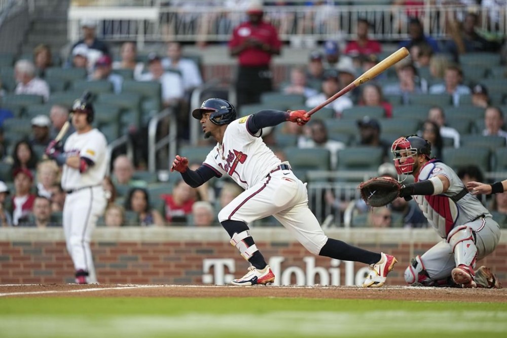 Atlanta Braves' Ozzie Albies (1) hits a singles in the third inning of a baseball game against the Washington Nationals, Wednesday, May 29, 2024, in Atlanta. (AP Photo/Brynn Anderson)
