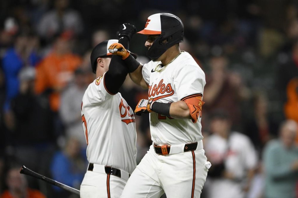 Baltimore Orioles' Ramon Urias, right, celebrates his home run against the Boston Red Soxs with James McCann during the seventh inning of a baseball game Wednesday, May 29, 2024, in Baltimore. (AP Photo/Nick Wass)